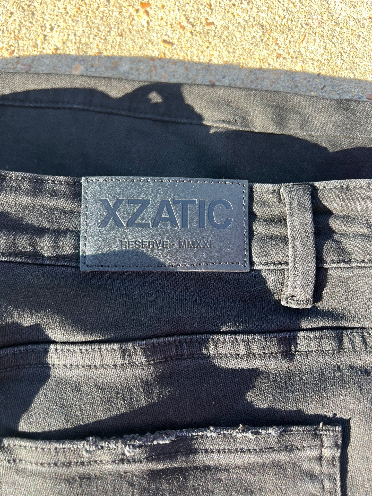 Black Xzatic denim with button up pants leg