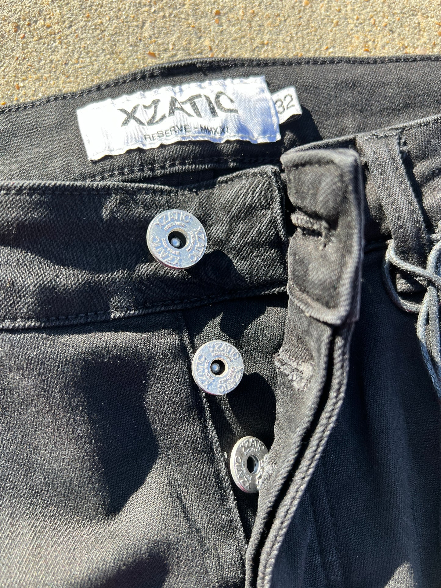 Black Xzatic denim with button up pants leg